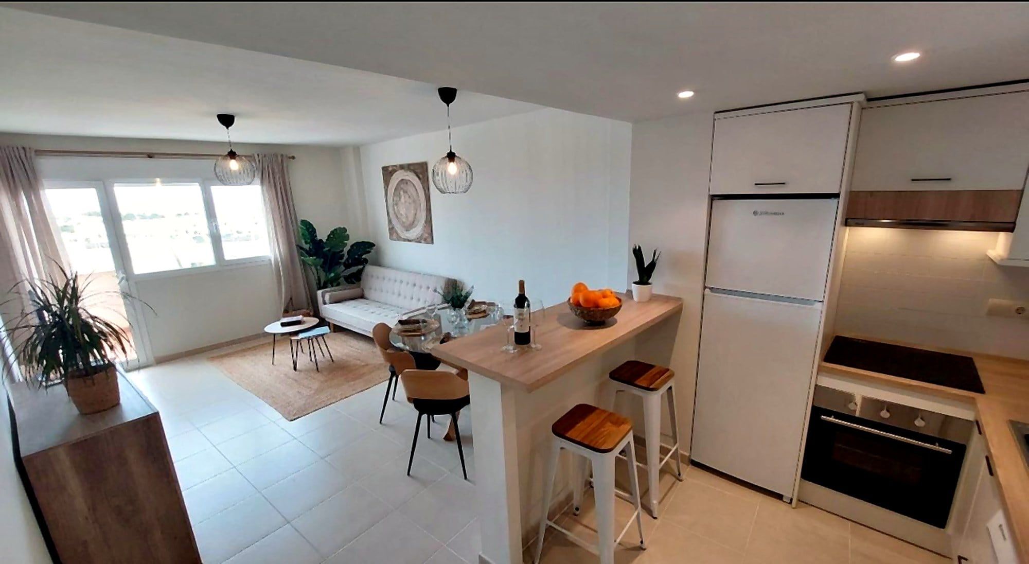 Piso Mediterráneo: cocina abierta al salón con barra, reforma integral de Reforma tu Idea